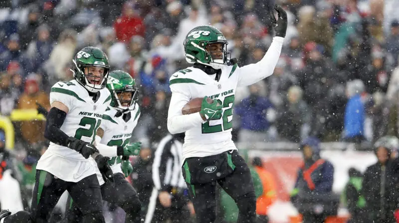 FOXBOROUGH, MASSACHUSETTS - JANUARY 07: Ashtyn Davis #21, Michael Carter II #30 and Tony Adams #22 of the New York Jets celebrate in the snow after an interception in the fourth quarter during a game against the New England Patriots at Gillette Stadium on January 07, 2024 in Foxborough, Massachusetts. (Photo by Winslow Townson/Getty Images)